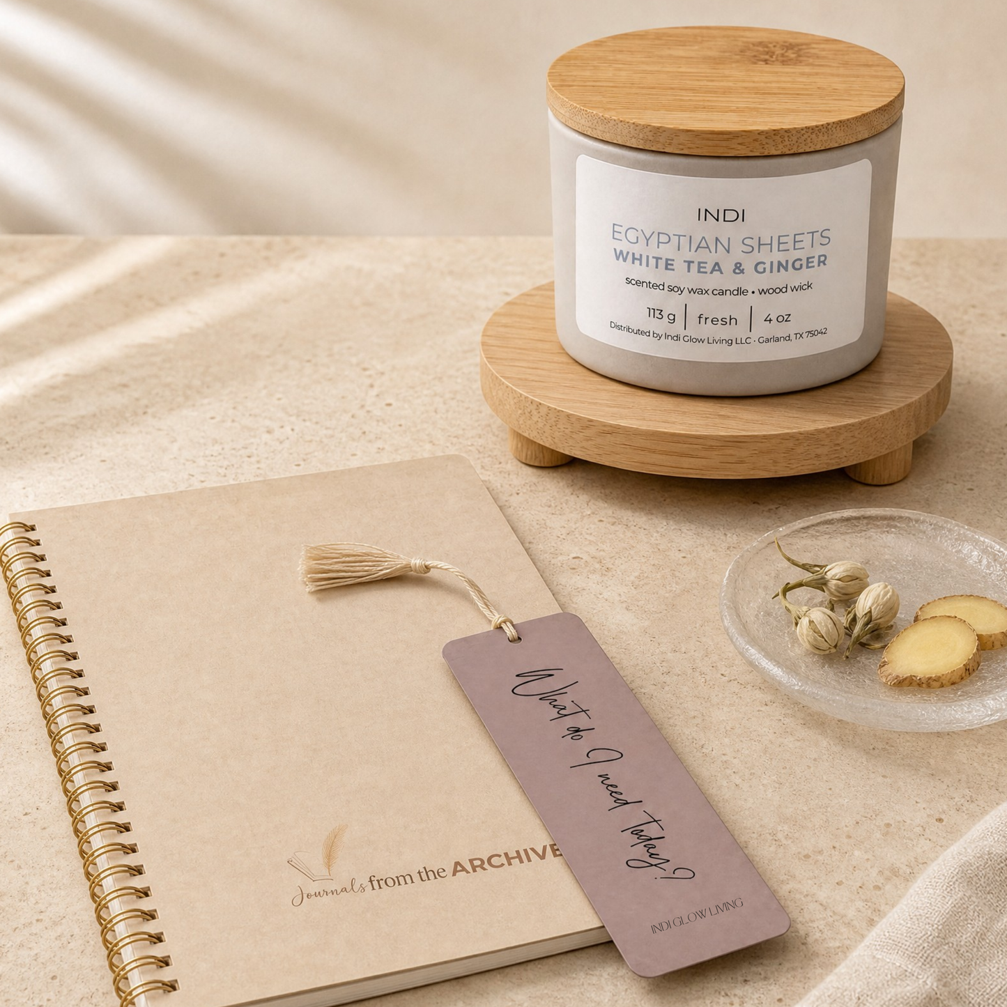 The Quiet Set — Egyptian Sheets candle with white tea and ginger scent beside the Linen Journal, lined or unlined pages, by INDI GLOW LIVING